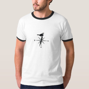 Pájaro en una camiseta del compás