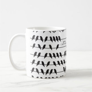 pájaro en una taza del alambre