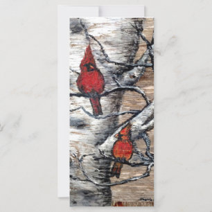 Pájaros del cardenal rojo encaramados en una tarje