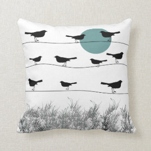 Pájaros en una almohada del alambre