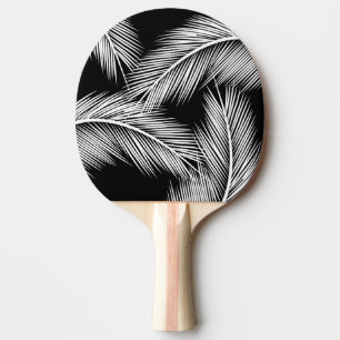 Pala De Ping Pong Hojas blancas de palma en el fondo de color negro