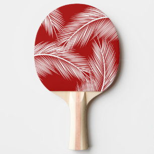 Pala De Ping Pong Hojas blancas de palma en el fondo de color rojo