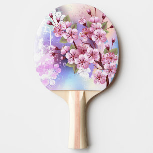 Pala De Ping Pong Sakura rosa sobre fondo de pintura