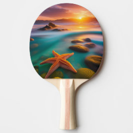Pala De Ping Pong Starfish en la playa al amanecer