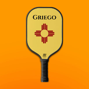 Palas De Pickleball Bandera de Nuevo México con el símbolo Zia
