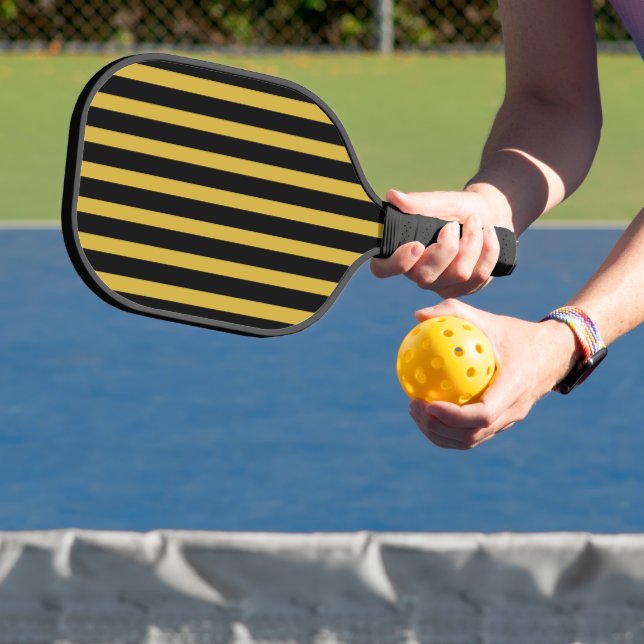 Palas De Pickleball Black and Metallic Gold Striped Pickleball Paddle (in situ)