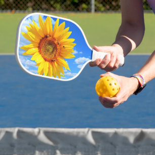 Palas De Pickleball Girasol y abejas sobre el remo de bolas azules