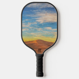 Palas De Pickleball Hermoso amanecer sobre dunas de arena en madera