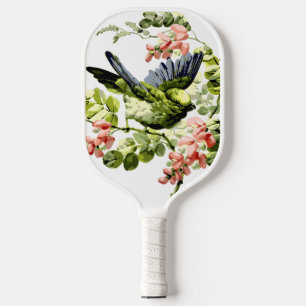 Palas De Pickleball Loro joven y encantador en árbol floreciente