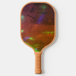 Palas De Pickleball luces de neón en superficie de roca agrietada