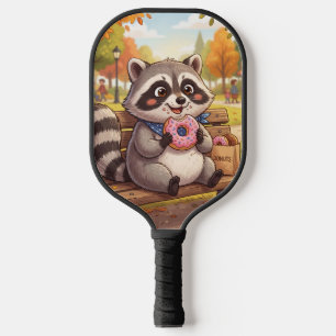 Palas De Pickleball Mapache de dibujos animados lindo comiendo donut d
