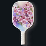 Palas De Pickleball Sakura rosa sobre fondo de pintura<br><div class="desc">Dibujado artísticamente,  rama de rosa,  flores de cerezo sobre fondo pintoresco,  texturizado,  pintado con pintura blanca,  rosa y azul. Pink Sakura</div>