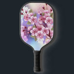 Palas De Pickleball Sakura rosa sobre fondo de pintura<br><div class="desc">Dibujado artísticamente,  rama de rosa,  flores de cerezo sobre fondo pintoresco,  texturizado,  pintado con pintura blanca,  rosa y azul. Pink Sakura</div>