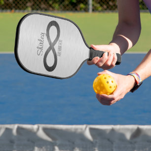 Palas De Pickleball Símbolo infinito sobre textura falsa Metalizado de