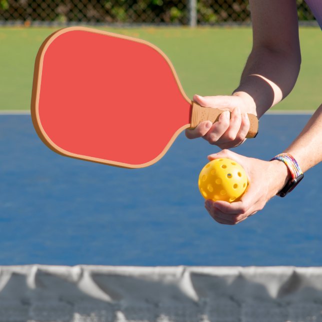 Palas De Pickleball un fondo rojo con un borde blanco (in situ)