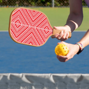 Palas De Pickleball un fondo rojo y blanco con un patrón de diamante