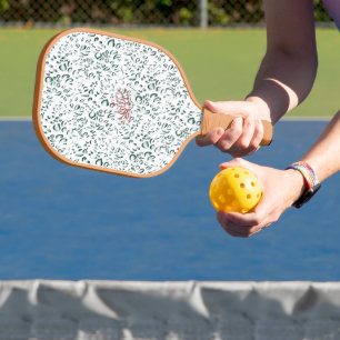 Palas De Pickleball una flor roja sobre un fondo negro