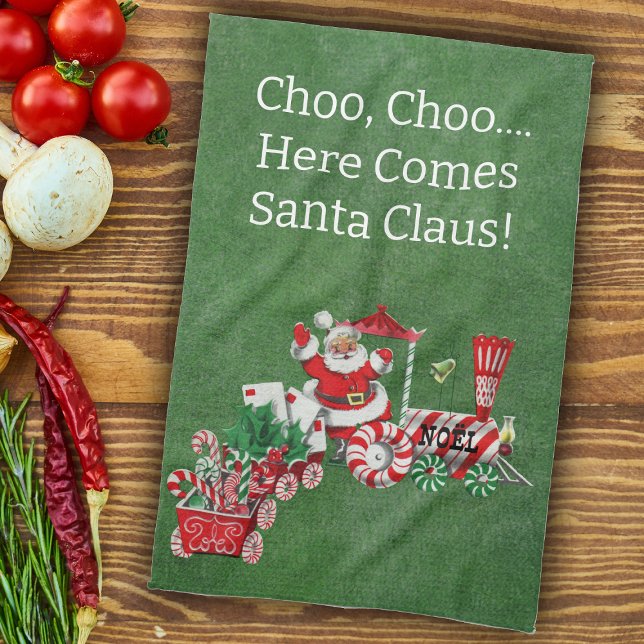 Paño De Cocina Aquí viene Santa sobre los Navidades del Candy (Here come Santa riding Christmas train with candy, letters on green kitchen Chrismtas towel.)