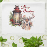 Paño De Cocina Deer and Christmas Lantern Kitchen Towel<br><div class="desc">This holiday design features an antique lantern and deer. This Christmas vignette is trimmed with evergreens and red berries.</div>