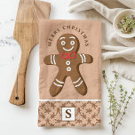 Paño De Cocina Hombre de pan de jengibre Marrón Monograma Feliz N<br><div class="desc">Celebra la temporada de fiestas con este personalizado de pan de jengibre. Con un lindo hombre de pan de jengibre con corbata de arco rojo, un saludo festivo de "Feliz Navidad" y un monograma personalizado sobre fondo marrón, esta toalla añade un toque divertido y festivo a la decoración de tu...</div>