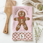 Paño De Cocina Hombre de pan de jengibre Monograma rosa Feliz Nav<br><div class="desc">Celebra la temporada de fiestas con este personalizado de pan de jengibre. Con un lindo hombre de pan de jengibre con corbata de arco rojo, un saludo festivo "Feliz Navidad" y un monograma personalizado sobre un fondo rosado, esta toalla añade un toque divertido y festivo a la decoración de tu...</div>