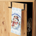 Paño De Cocina Let It Snow - Holiday Snowman Kitchen Towel<br><div class="desc">This adorable snowman is all decked out for the Christmas holiday. Set on a background pattern of light blue snowflake,  the snowman is wearing a black,  high top hat and a red scarf.</div>