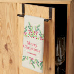 Paño De Cocina Navidades de las hojas de acuarela y de las berrie<br><div class="desc">Elegante acuarela de hojas verdes y bayas rojas sobre un fondo de marfil,  Feliz Navidad y tu apellido en letras de moda,  esta toalla de cocina es un hermoso complemento a la decoración de vacaciones de tus Navidades. COINCIDIENDO elementos de nuestra colección.</div>