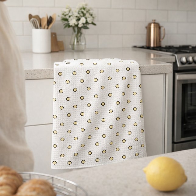 Paño De Cocina Patrón de círculo amarillo y negro (A kitchen towel with a pattern of yellow and black dots)