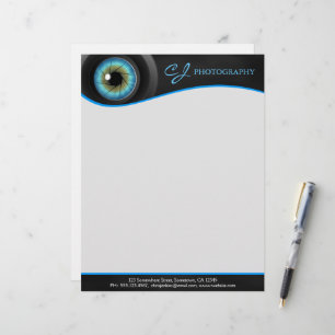 Papel con membrete de la lente de cámara del ojo