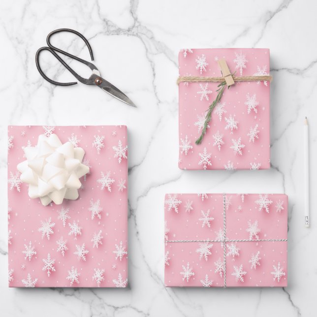 Papel de envoltura rosa festivo con copos de nieve (Anverso)