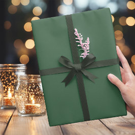 Papel de envolvimiento verde para los Navidades os