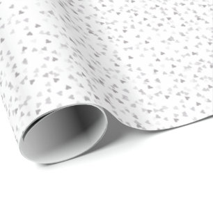Papel de regalo con confeti de corazones de plata