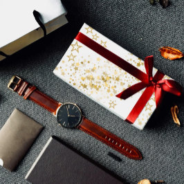 Papel de regalo con estrellas doradas