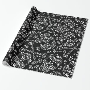 Papel de regalo con patrón de calaveras y huesos e