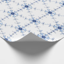 Papel de regalo con patrón de copo de nieve en dia
