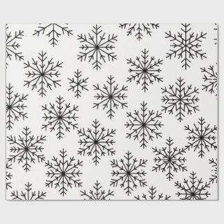 Papel de regalo con patrón de copo de nieve en neg