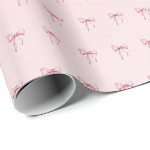 Papel de regalo con patrón de lazo rosa
