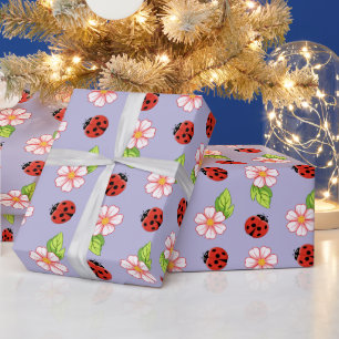 Papel de regalo con patrón de mariquita y margarit