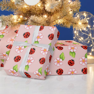 Papel de regalo con patrón de mariquita y margarit