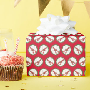Papel de regalo de bogavantes y ramas de acebo