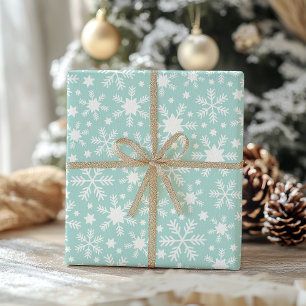 Papel de regalo de copo de nieve blanco y azul