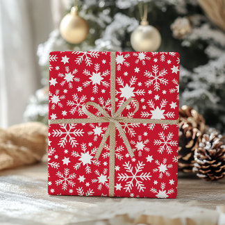 Papel de regalo de copo de nieve blanco y rojo
