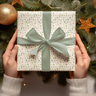 Papel de regalo de copos de nieve dorados y pino
