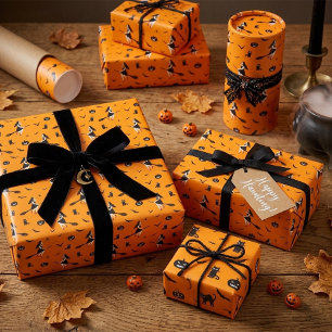 Papel de regalo de Halloween naranja con brujas