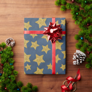 Papel De Regalo Estrella dorada con brillo de Navidad sobre azul a