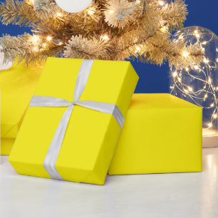 Papel De Regalo hoja amarilla en blanco, curvada en un borde