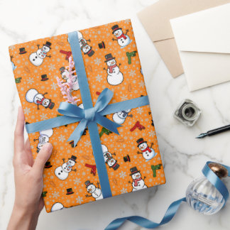 Papel De Regalo Muñecos de nieve y copos de nieve en naranja