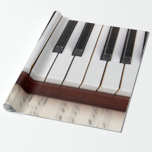 Papel De Regalo notas musicales sobre el fondo de una pianoacústic