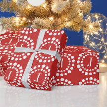 Papel de regalo rojo y blanco con monograma