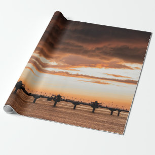 PAPEL DE REGALO SILHOUETTE DE PERSONAS EN LA PLAYA DURANTE EL SOL